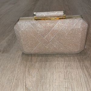 Charming Charlie’s gold sparkly clutch